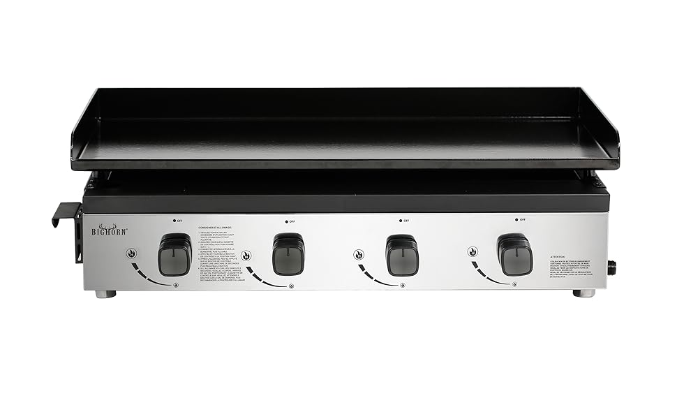 Grande plaque chauffante commerciale en acier inoxydable avec surface de cuisson noire. Quatre boutons de commande sur le panneau avant pour le réglage de la température. Conçu pour une utilisation professionnelle en cuisine.