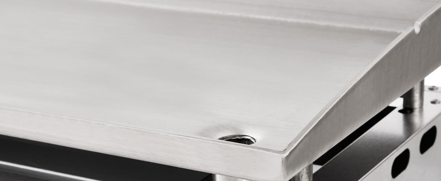 Détail rapproché d'une surface texturée gris clair ou blanche, éventuellement d'un tissu, d'un échantillon de matériau ou de la texture du produit présentant un motif subtil et une variation de surface.